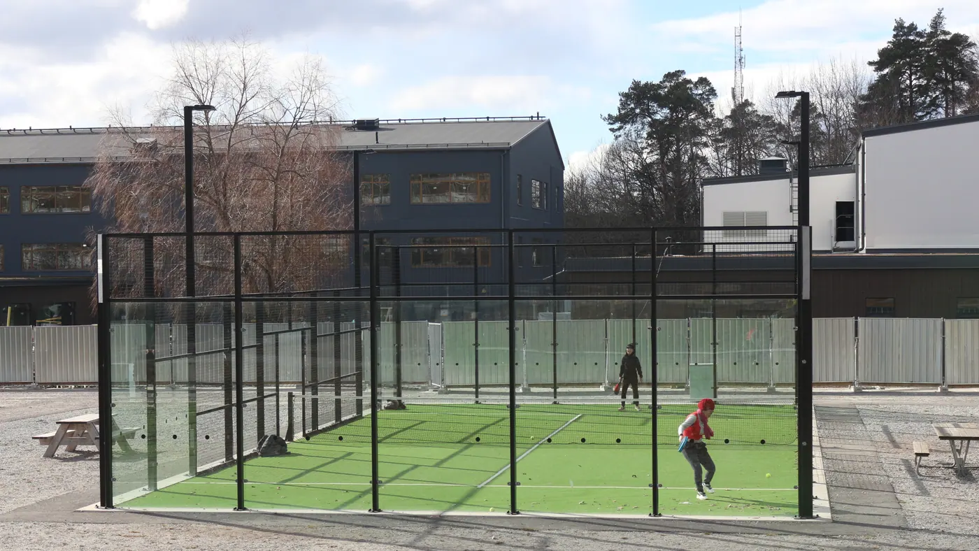 Players meeting through a padel match on court