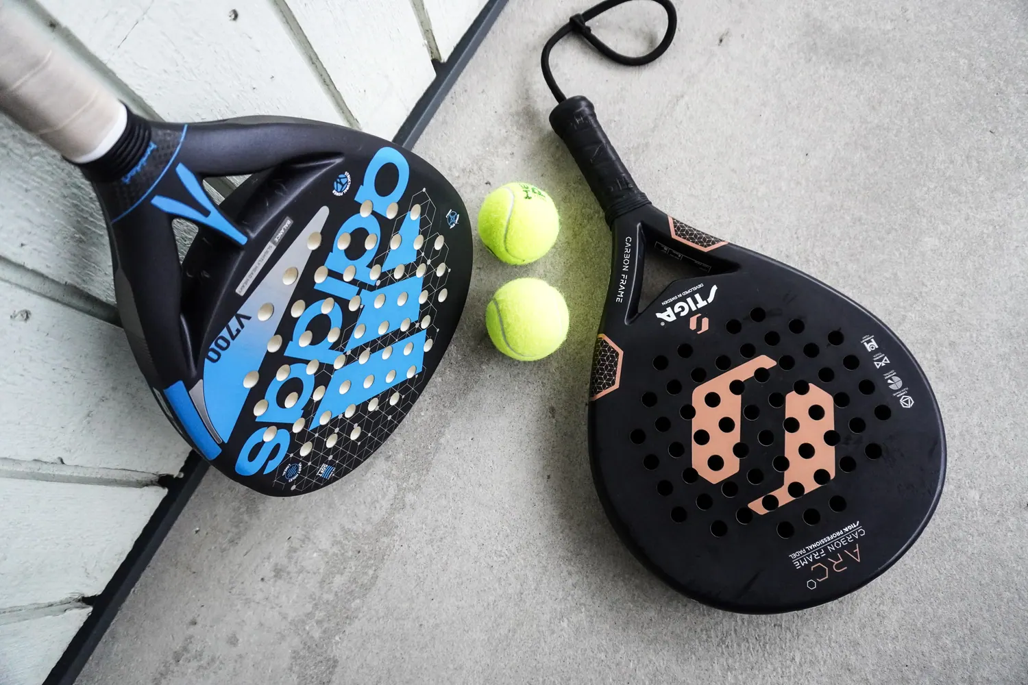 Padel rackets and balls arranged before play