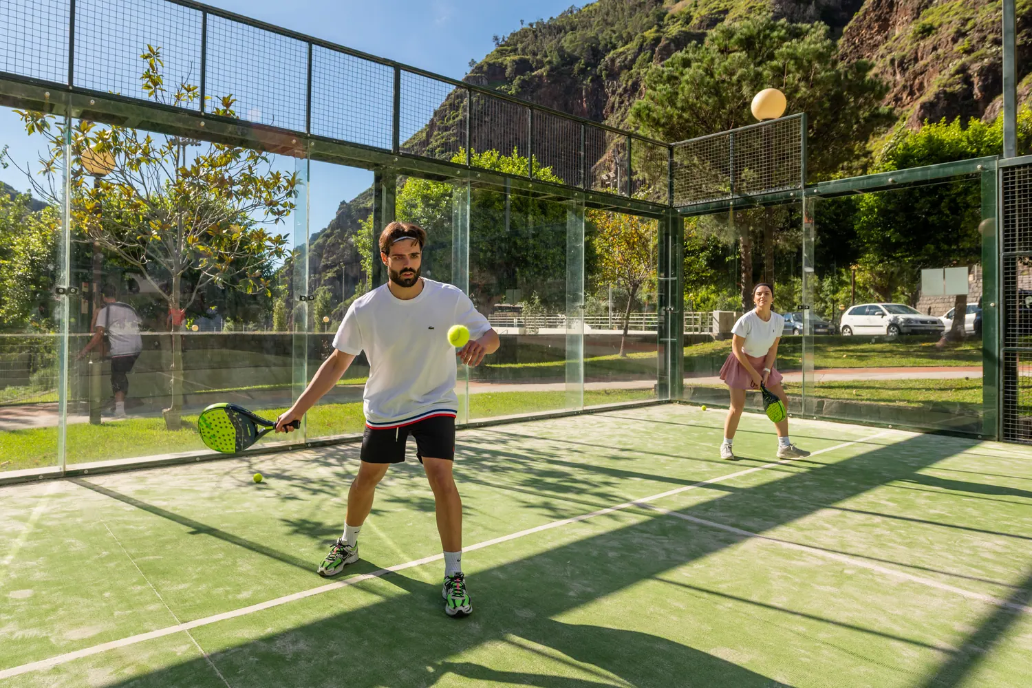 Padel players on court during a club session